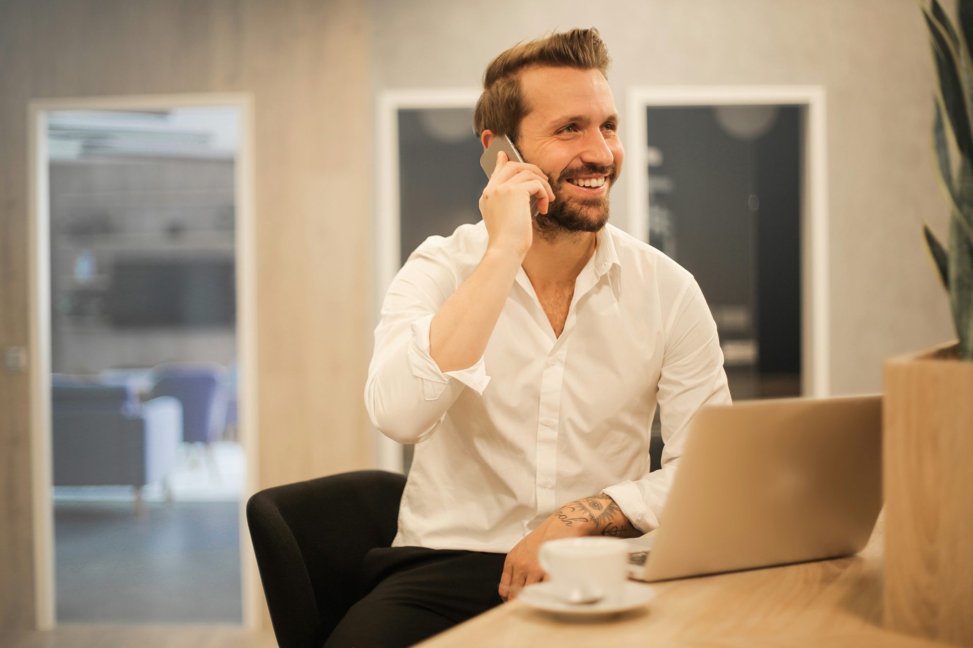 A business owner on the phone, following up with a new enquiry